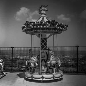 Invisible child playing on a merry-go-round - Silver Oblivion
